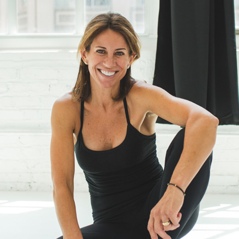 Stacey Vandiver smiling confidently at Soulbody Studios in Fort Myers, FL, radiating warmth and creativity